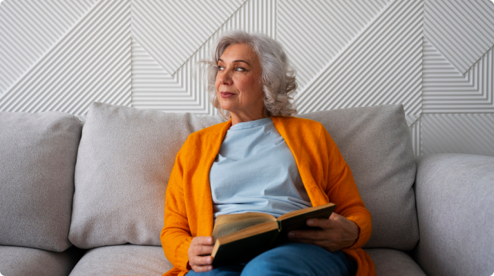 older woman reading book